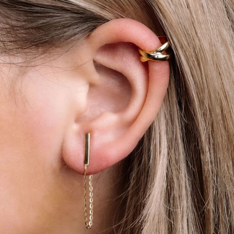 ear with gold chain earrings and ear cuff
